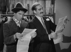 Grouch Marx and Chico Marx discuss the "Sanity Clause" in A Night at the Opera.