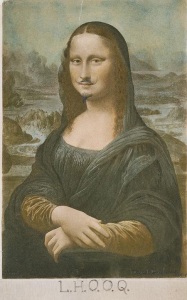 Marcel Duchamp pins the mustache on the Mona Lisa (1919).