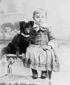 A boy and his dog, circa 1900. The dog does look a little like Gracie.