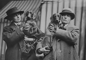 Una Troubridge and Radclyffe Hall and two Dachsunds.